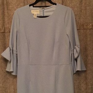 Light blue dress with bows on the sleeves